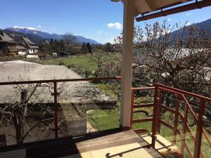 a balcony of a house with a view of the mountains at Haus KAIROS in Spittal an der Drau