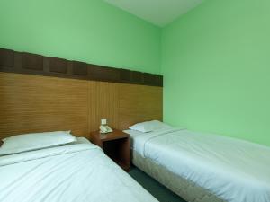 Postel nebo postele na pokoji v ubytování Royal Hotel