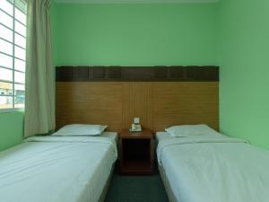 Postel nebo postele na pokoji v ubytování Royal Hotel
