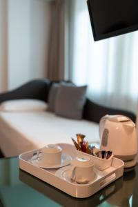 Postel nebo postele na pokoji v ubytování Hotel Buonconsiglio