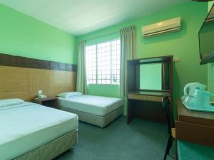 Postel nebo postele na pokoji v ubytování Royal Hotel