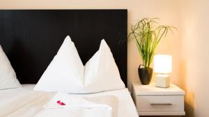 Stadthotel Kramer客房内的一张或多张床位
