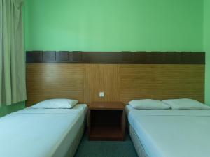 Postel nebo postele na pokoji v ubytování Royal Hotel