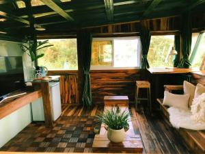 a living room with a couch and a table at 秘密花園設計villas Sun Moon Lake Secret Garden Design Villas in Yuchi