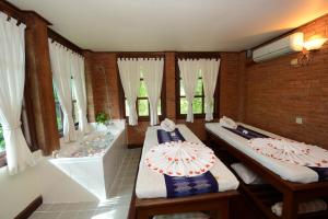 Katil atau katil-katil dalam bilik di Bagan Thiripyitsaya Sanctuary Resort