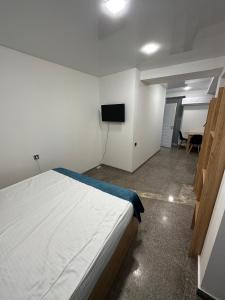 Voodi või voodid majutusasutuse Friendly Hotel toas