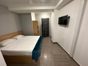 Voodi või voodid majutusasutuse Friendly Hotel toas