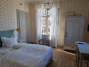 Postel nebo postele na pokoji v ubytování Thottska Villan