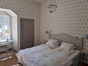 Postel nebo postele na pokoji v ubytování Thottska Villan