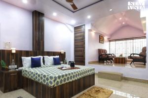 a bedroom with a bed in a room at StayVista's Sunara Trails - Pet-Friendly, Mountainside Retreat with Balcony & Indoor-Outdoor Games - Near Panna National Park in Panna