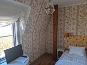 Postel nebo postele na pokoji v ubytování Thottska Villan