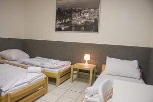 Postel nebo postele na pokoji v ubytování Hostel Seven