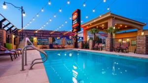 a swimming pool in a hotel at night at Aiden by Best Western St George in St. George