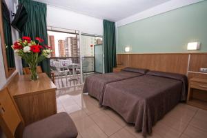 Postel nebo postele na pokoji v ubytování Hotel Perla