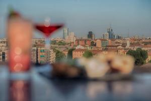 a view of a city skyline with a wine glass at Radisson Blu Hotel Milan in Milan