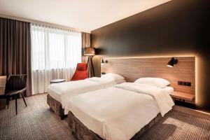 Łóżko lub łóżka w pokoju w obiekcie Park Inn by Radisson Krakow