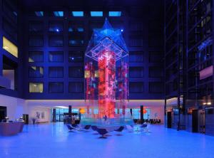 a large lit up sculpture in a building at night at Radisson Blu Hotel Zurich Airport in Kloten