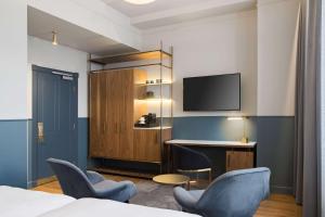 Televiisor ja/või meelelahutuskeskus majutusasutuses Radisson Collection Astorija Hotel, Vilnius