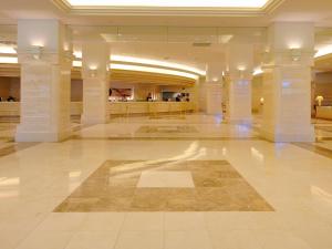 a large building with a lobby with columns at Rusutsu Resort Hotel & Convention in Rusutsu