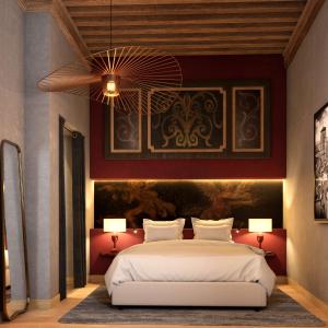 a bedroom with a large bed and a ceiling fan at Cour des Loges Lyon, A Radisson Collection Hotel in Lyon