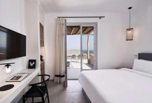Postel nebo postele na pokoji v ubytování Radisson Blu Euphoria Resort, Mykonos + 37 fotografií