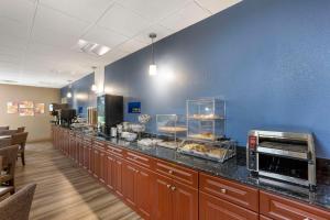 a cafeteria with a counter with food on it at Best Western Grantville Hershey in Grantville
