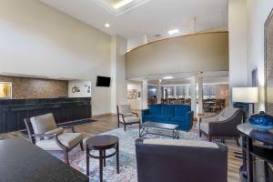 a lobby with a blue couch and chairs at Best Western Grantville Hershey in Grantville