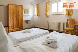 Tempat tidur dalam kamar di Pension zum Hexenstieg