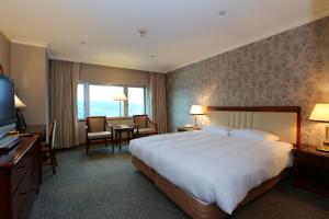 Gulta vai gultas numurā naktsmītnē Evergreen Laurel Hotel - Keelung