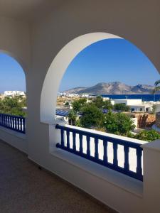 a balcony with a view of the mountains at Selini Studios in Koufonisia