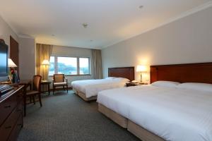 Gulta vai gultas numurā naktsmītnē Evergreen Laurel Hotel - Keelung
