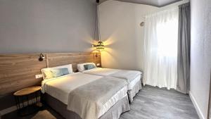 Ein Bett oder Betten in einem Zimmer der Unterkunft Caleta Dorada
