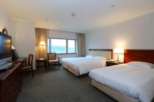 Gulta vai gultas numurā naktsmītnē Evergreen Laurel Hotel - Keelung