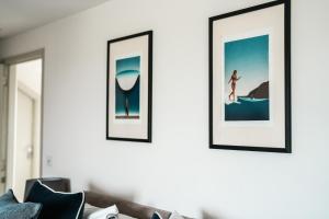 a living room with three framed pictures on the wall at Macdonald's Farm in Saint Ervan