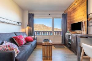 TV a/nebo společenská místnost v ubytování Résidence Le Necou - Les Menuires + 16 fotografií