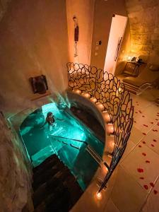 an overhead view of a swimming pool in a building at Pollicastro Boutique Hotel in Lecce
