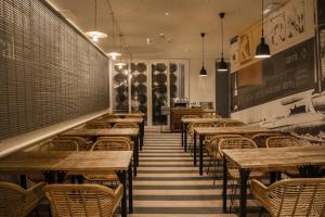 a row of tables and chairs in a restaurant at Select Liberdade in Lisbon