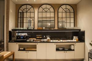 a kitchen with a counter with food on it at room Select Liberdade in Lisbon