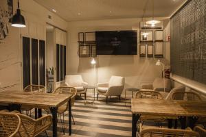 a restaurant with tables and chairs in a room at Select Liberdade in Lisbon +29 photos