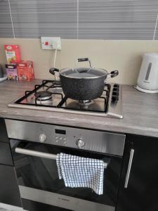 a pot sitting on top of a stove in a kitchen at House 36 in Liverpool