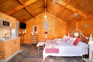 a bedroom with a bed in a wooden room at los diablitos 4 in San Juan de la Rambla