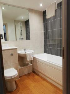 A bathroom at Pelican House is an exclusive contemporary development