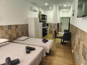 Postel nebo postele na pokoji v ubytování РUEВLO МAR, hotel-apartamento