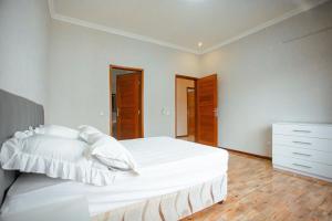 Tempat tidur dalam kamar di Ponta d’ ouro lia’s house