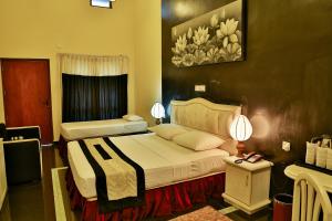Letto o letti in una camera di Miridiya Lake Resort