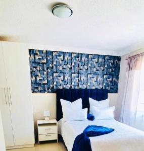 Voodi või voodid majutusasutuse 3 Bed House in Malbereign Harare toas