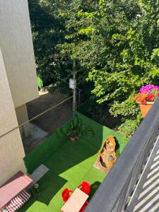an overhead view of a garden with a table and flowers at villa with beautiful view 4 in Tbilisi City