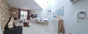 a living room with a couch and a table at Es Closet in El Port de la Selva