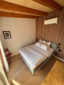 a bedroom with a bed in a room at Los Dos Caballeros Winery & Vacation Rental in Llubí