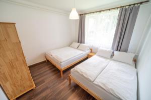Posteľ alebo postele v izbe v ubytovaní Apartmány Olešnice
